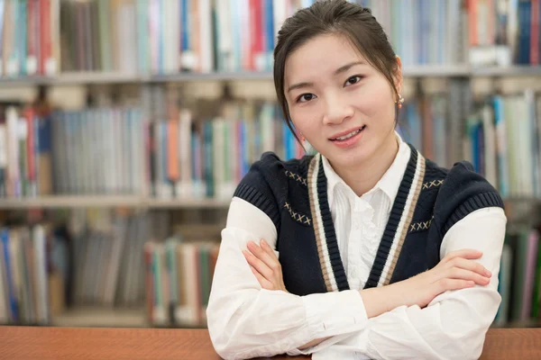 Student resting on wooden shelf