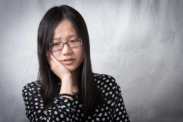 Girl holding her face — Stock Photo, Image