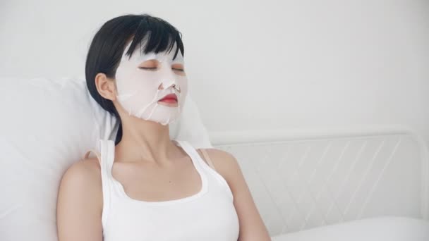 Beautiful Young Asian Woman Sheet Facial Mask Sleep Bed Bedroom — Stock Video