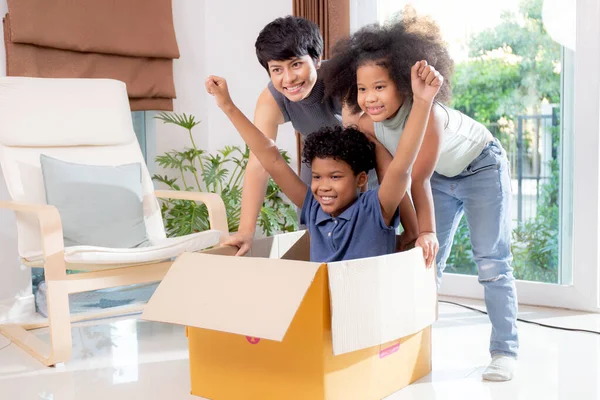 Happiness African Family Mother Daughter Pushing Cardboard Box Son Excited — Stock Photo, Image