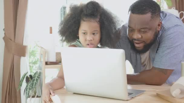 African America Father Daughter Learning Recipe Cooking Online Laptop Computer — Stock Video
