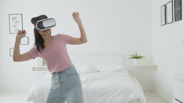 Young Asian Woman Wearing Headset Playing Game Excited Bed Bedroom — Stock Video