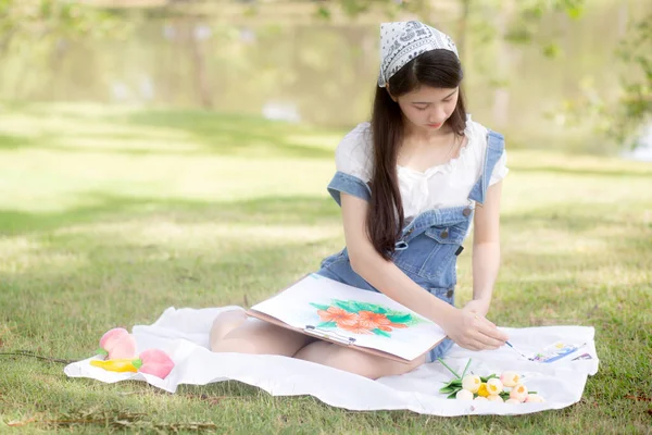 Young Asian Woman Sitting Drawing Picture Colorful Paint Brush While — 스톡 사진