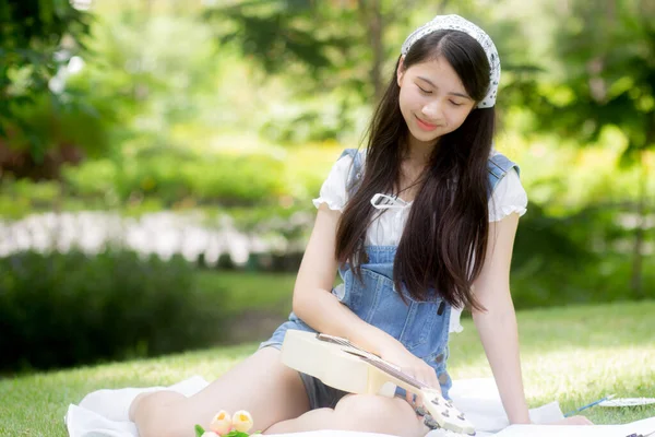 Happiness Young Asian Woman Sitting Playing Ukulele While Relaxation Entertainment — 스톡 사진