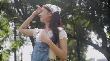 Beautiful young asian woman feeling good with cheerful on summer in nature, breathing fresh in vacation at forest, girl relax and environment, health and emotion, lifestyles concept.