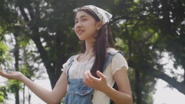 Beautiful young asian woman feeling good with cheerful on summer in nature, breathing fresh in vacation at forest, girl relax and environment, health and emotion, lifestyles concept.