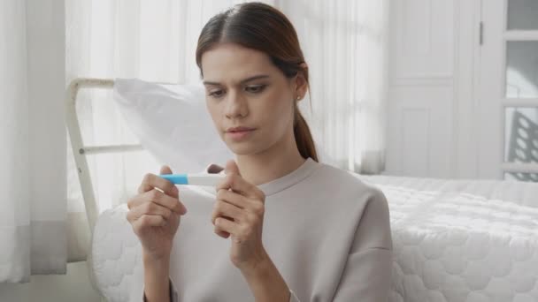 Beautiful Young Caucasian Woman Expression Depressed Unexpected Looking Pregnancy Test — Vídeo de Stock