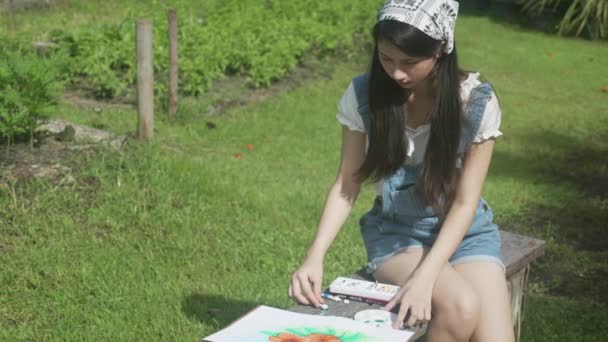 Young Asian Woman Sitting Drawing Picture Colorful Paint Brush While — Stock videók