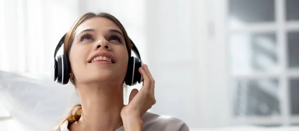 Happy Young Woman Wearing Headphones Listening Music While Using Laptop — Φωτογραφία Αρχείου