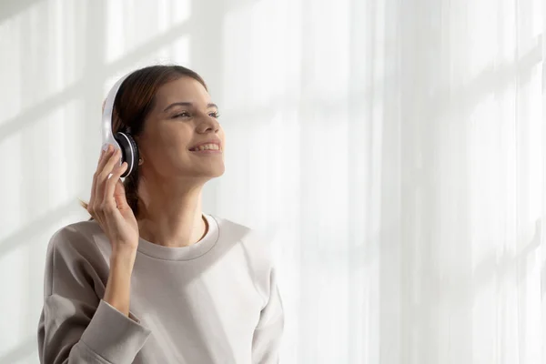 Happy Young Woman Wearing Headphones Listening Music While Dancing Singing — Foto Stock