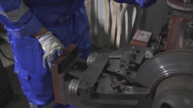 Closeup hands of young man sanding or iron at industrial factory, mechanic working job while polish metal, male having skill built steel with tool, labor and steelworks, industry concept.