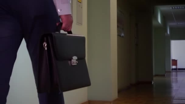 Businessman Trousers Shirt Walks Corridor Holding Black Briefcase His Hand — Stock Video