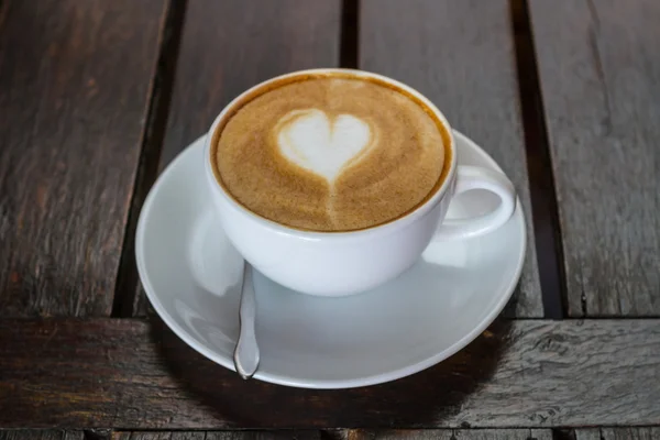 Coffee on a wooden table — Stock Photo, Image