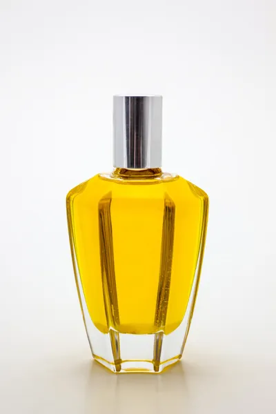 Aroma oil in hexagonal glass bottle on white background — Stock Photo, Image