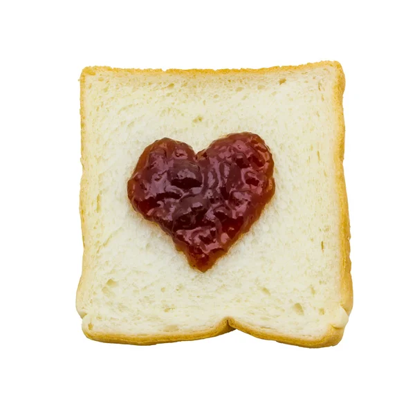 Slice of bread with red jam heart — Stock Photo, Image