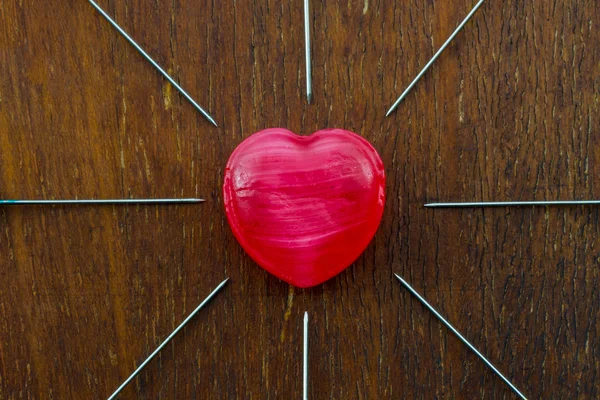 Red heart and needles. — Stock Photo, Image