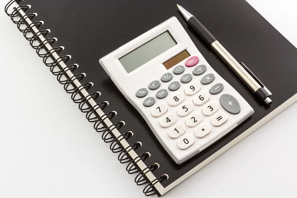 Calculator with notebook & pen — Stock Photo, Image