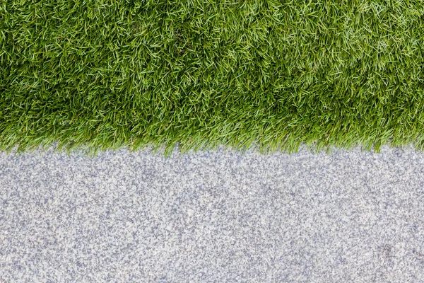 Green grass and the other half is granite. — Stock Photo, Image