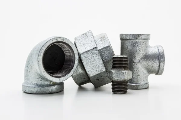 Iron pipe fittings for plumbing. — Stock Photo, Image