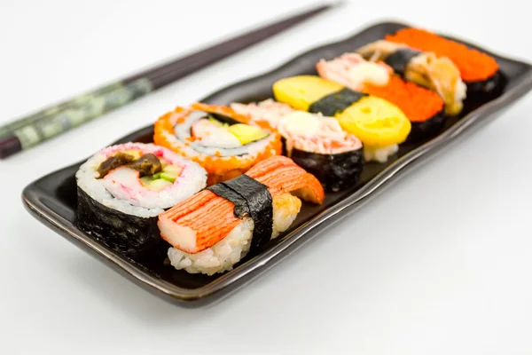Sushi with chopsticks. — Stock Photo, Image