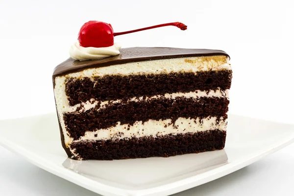 Chocolate cake slice with red cherry fruit. — Stock Photo, Image