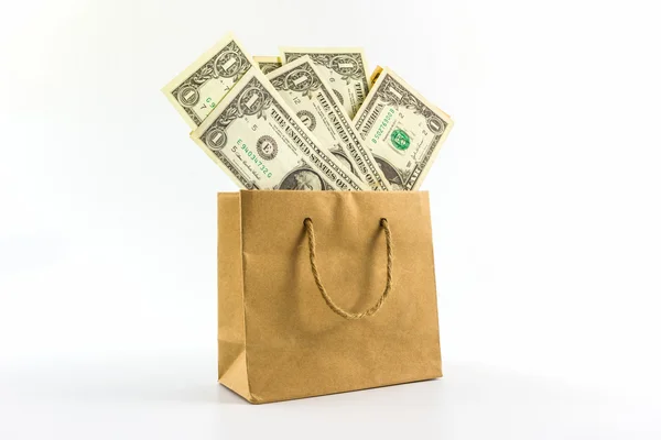 Dollar biljetten in bruine papieren zak. — Stockfoto