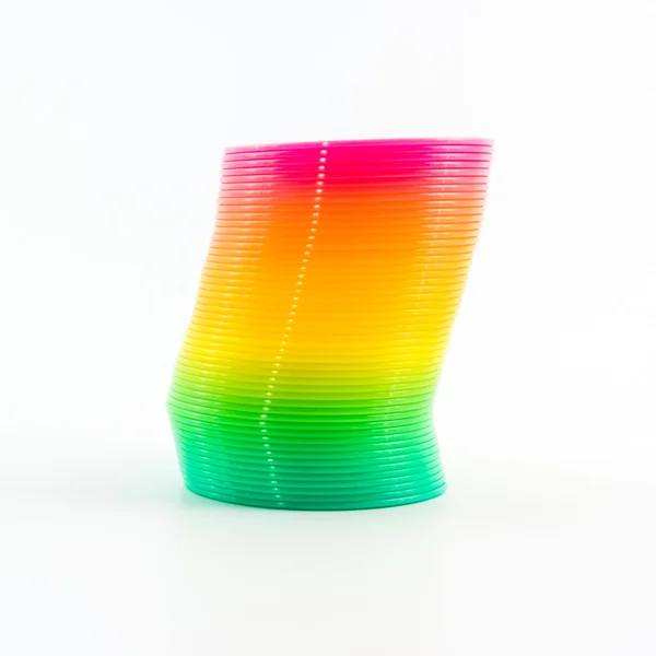 Rainbow colored wire spiral toy. — Stock Photo, Image