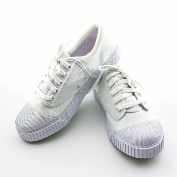 Biały sport buty na białym tle. — Zdjęcie stockowe