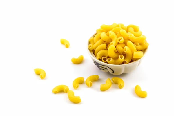 Raw macaroni in bowl. — Stock Photo, Image