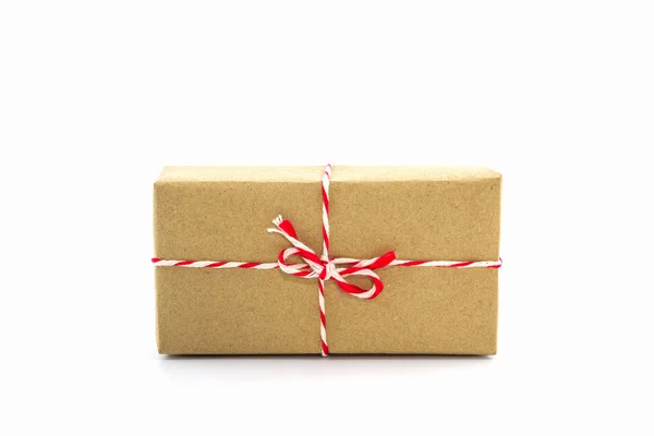 Cardboard carton wrapped with brown paper, tied with string. — Stock Photo, Image