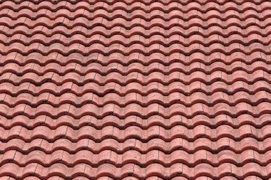 Dikişsiz turuncu bir çatı döşeme doku arka planı.