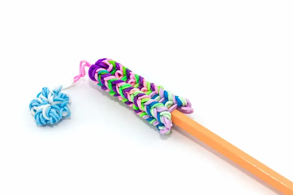 Colorful elastic rainbow loom bands with pencil. — Stock Photo, Image