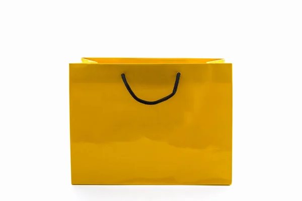 Bolsa de compras de papel amarillo en blanco . — Foto de Stock