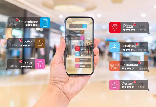 Augmented reality marketing in the shopping mall. Hand holding smart phone use AR application to check information