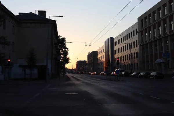 Empty street in the city at sunrise