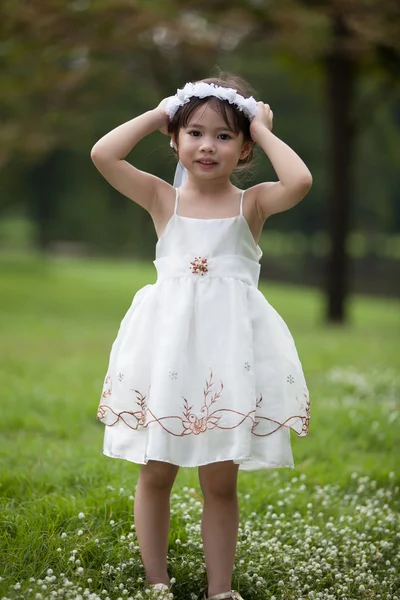 Little cute girl in garden — Stock Photo, Image