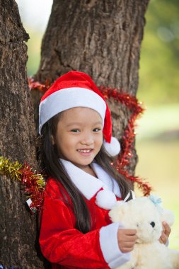 küçük kız soyunma Noel Baba olarak zevk