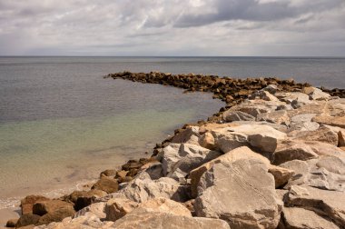 A rocky jetty jutting out into the sea