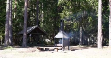 Barbecue with a roof for barbecue in the forest park area.