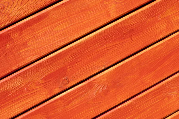 Wooden wall painted in bright orange — Stock Photo, Image