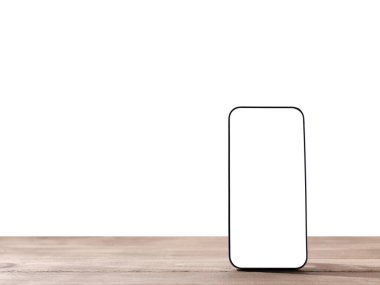 Ayrı bir arkaplanı olan akıllı telefon masadadır