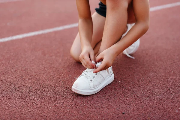 Little Girl Sat Tie Her Shoelaces Running Training Stadium Sunset — Stock Photo, Image
