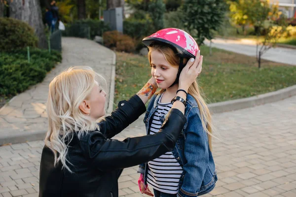 Mom Helps Dress Her Little Daughter Gear Helmet Segway Ride — Stock Photo, Image