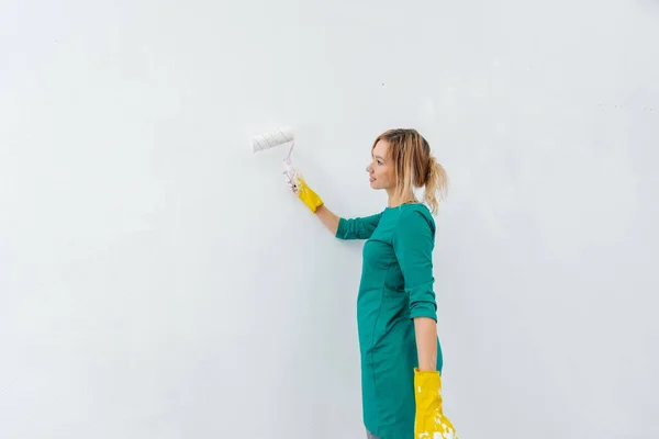 Young Girl Engaged Repairs Paints White Wall Roller New Apartment Stock Picture