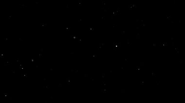 Havada yüzen gerçek toz parçacıkları. Toz Parçacıkları Arkaplanı. Makro yavaş çekim, karıştırma kipi kullan (ekran)