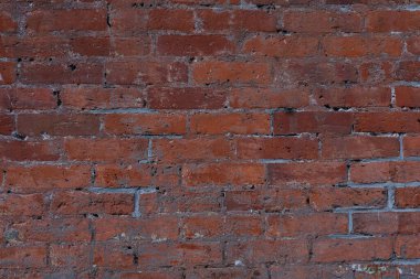 Urban red brick wall close up.