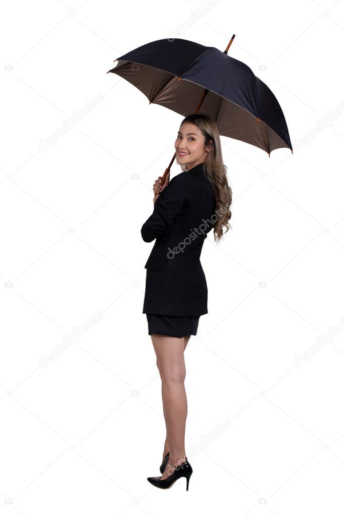 Isolated photo of Isolated photo of businesswoman in black suit standing and holding umbella in hands turn her face to looking something.