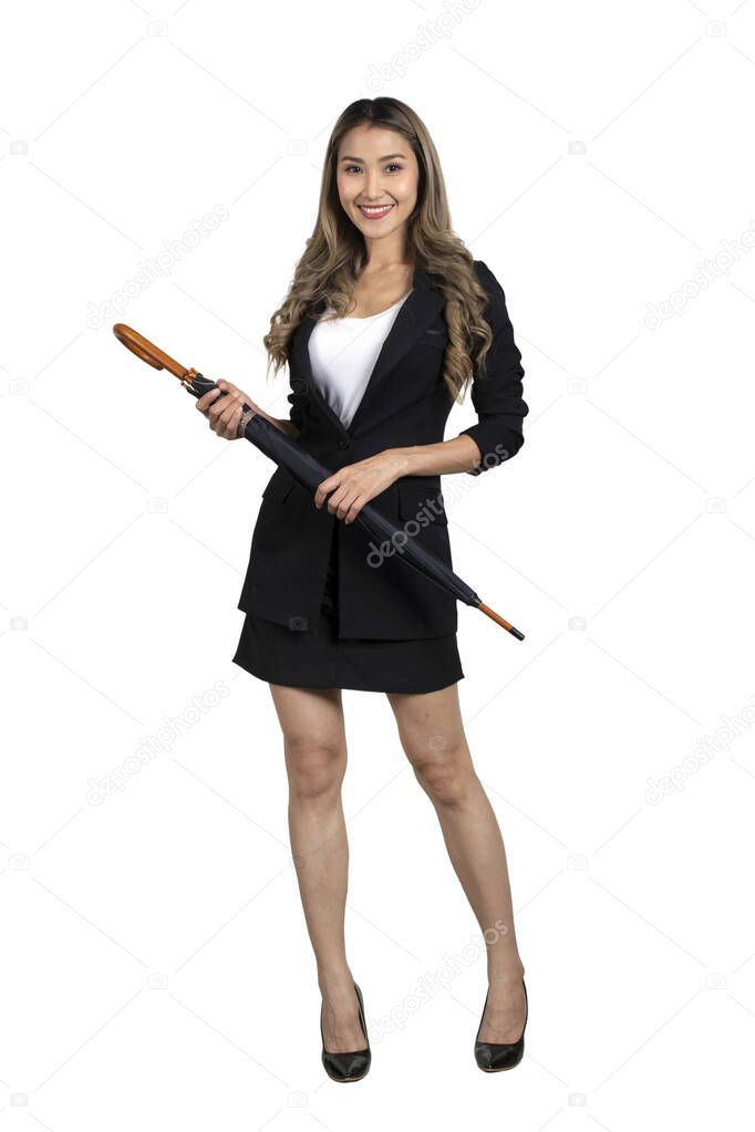 Businesswoman in black suit standing and holding umbella in hands on white background.