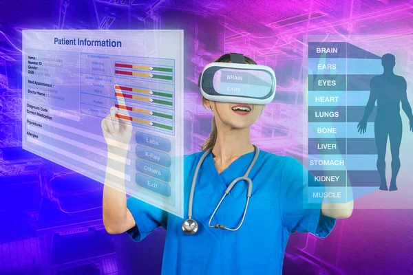 Female doctor wearing 3D virtual reality glasses examining patient data from virtual reality system.