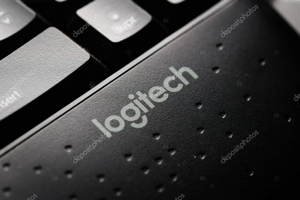 Logitech company brand logo in a modern black keyboard. Macro close up detail.